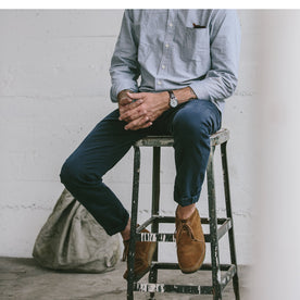 The fit model sitting on a stool