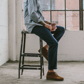 Fit model leaning against a wall