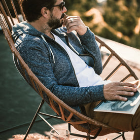 The fit model relaxing in his hoodie