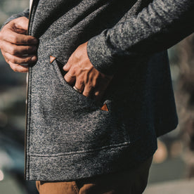 The fit model showing the pockets on the apres hoodie