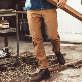 The fit model working in his chore pants in his garage