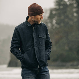 fit model looking over left shoulder wearing The Watts Jacket in Dark Navy