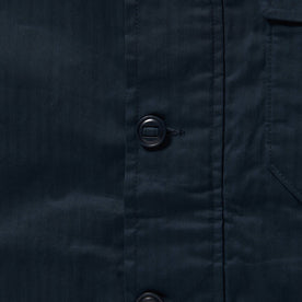 material shot of front placket and buttons of The Watts Jacket in Dark Navy