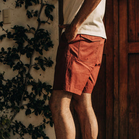 fit model wearing The Adventure Short in Rust, side profile