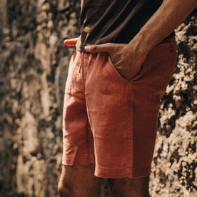fit model wearing The Apres Short in Rust Hemp, hands at sides