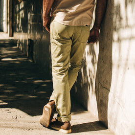 fit model wearing The Camp Pant in Olive Herringbone, back shot
