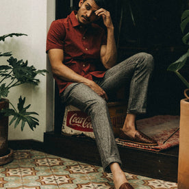 fit model wearing The Easy Pant in Espresso Linen, sitting down indoors