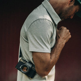 fit model wearing The Heavy Bag Polo in Natural and Ash Stripe, side shoulder shot