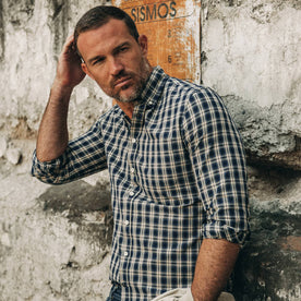 fit model wearing The Jack in Marino Plaid, leaning against wall