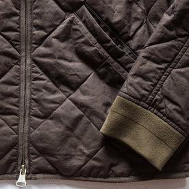 material shot of The Quilted Bomber Jacket in Espresso, front pocket and sleeve