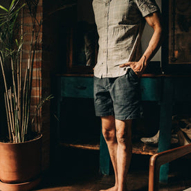 fit model wearing The Trail Short in Navy Reverse Sateen, hands in pockets