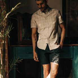 fit model wearing The Trail Short in Navy Reverse Sateen, looking down