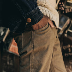 fit model wearing The Camp Pant in Stone Boss Duck, side shot