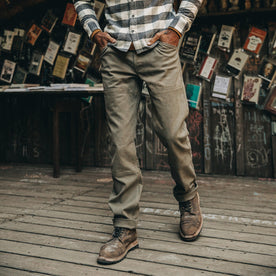fit model wearing The Chore Pant in Stone Boss Duck, hands in pockets