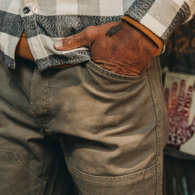 fit model wearing The Chore Pant in Stone Boss Duck, up close