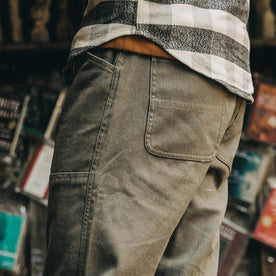 fit model wearing The Chore Pant in Stone Boss Duck, side