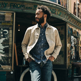 fit model wearing The Dispatch Jacket in Khaki Cord, looking left
