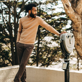fit model wearing The Double Knit Sweater in British Khaki, next to lookout point