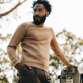 fit model wearing The Double Knit Sweater in British Khaki, looking left