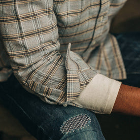 fit model wearing The Jack in Sky Plaid, cuffed over henley