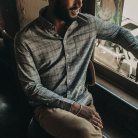 fit model wearing The Jack in Slate Plaid, sitting near window