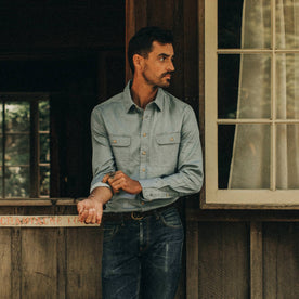 fit model wearing The Ledge Shirt in Sun Bleached Chambray, looking right