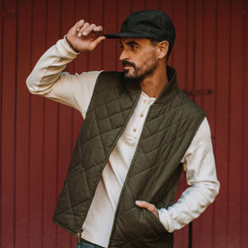 fit model holding The Ball Cap in Espresso Dry Wax
