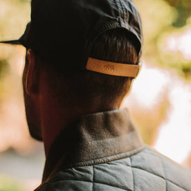 fit model from the back wearing The Ball Cap in Espresso Dry Wax
