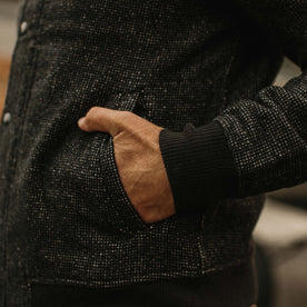 fit model wearing The Bomber Jacket in Charcoal Wool with hand in pocket