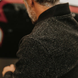fit model wearing The Bomber Jacket in Charcoal Wool showing back yoke