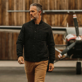 fit model wearing The Bomber Jacket in Charcoal Wool closed and walking