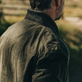 fit model wearing The Bomber Jacket in Waxed Olive showing back yoke