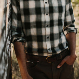 fit model with hands in pocket wearing The Jack in Coal Herringbone Check