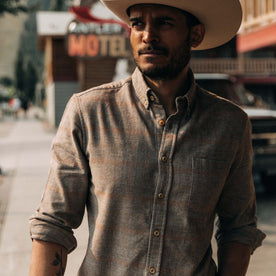 fit model wearing shirt with sleeves rolled up