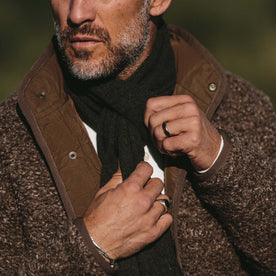 fit model wearing The Lodge, tightening scarf