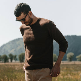 fit model wearing fit model wearing the lodge sweater, looking down