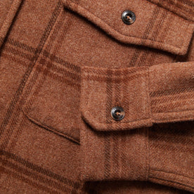 material shot of The Maritime Shirt in Espresso Plaid Wool showing chest pocket and sleeve cuff button