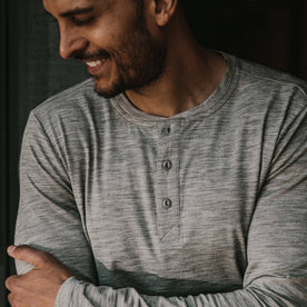 fit model wearing The Merino Henley, smiling