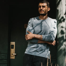 fit model wearing The Merino Henley, arms crossed