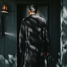 fit model wearing the robe from the back showing the belt loops the hold the robe tie