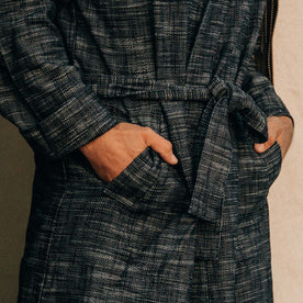 fit model wearing the robe with his hands in his pockets