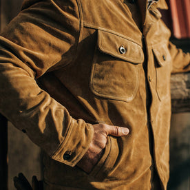 fit model wearing The Lined Long Haul Jacket in Sand Suede with hand in pocket