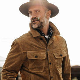 fit model wearing The Lined Long Haul Jacket in Sand Suede with popped collar