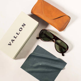 The Surf Aviator in Dark Tortoise, studio shot of box, cleaning microfiber towel, and case