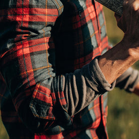 fit model showing sleeve of The Utility Shirt in Brushed Red Plaid
