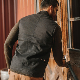 fit model wearing The Workhorse Vest in Coal Boss Duck, back shot