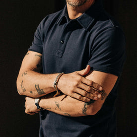 our fit model wearing The Heavy Bag Polo in Navy