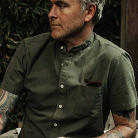out fit model wearing The Short Sleeve Bandit in Olive, looking right