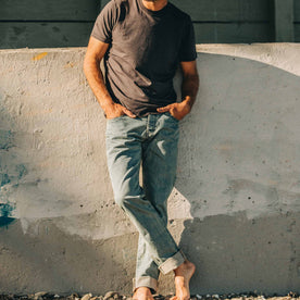 our fit model wearing The Democratic Jean in 24-Month Wash Japanese Selvage—hands in pockets, cropped shot