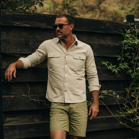 fit model wearing The Chore Shirt in Natural Herringbone, looking left of camera